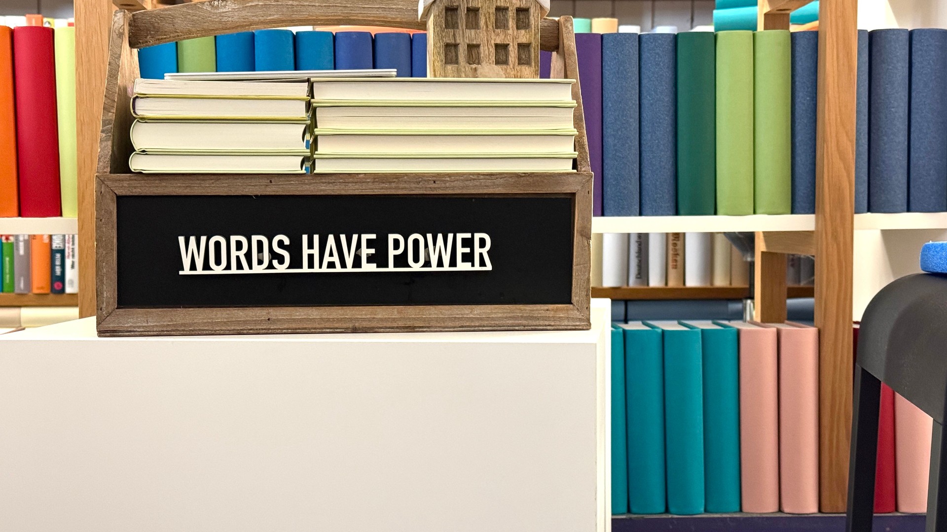 Words have power phrase on a wooden box in the library